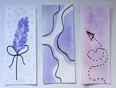 three handmade bookmarks with different designs on them, one is purple and the other is white