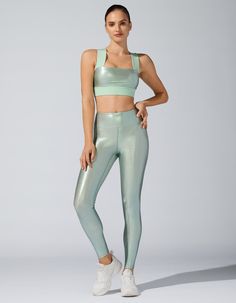 Make a statement with the iridescent fabric of the Marvel Legging. Marvel at the sheen on this legging and feel powerful and pretty at the same time. Show off at the gym or on the street.   Metallic fabric.  High waistband lined with power mesh  Self: 80% NYLON 20% SPANDEX  Mesh lining  Model is wearing a size small  Made in USA Washing Instructions:MACHINE WASH COLD INSIDE OUT ON DELICATE CYCLE; WASH WITH LIKE COLORS ONLY; WASH GARMENT INSIDE OUT; DO NOT TUMBLE DRY; DO NOT BLEACH; DO NOT IRON; LAY FLAT TO DRY Iridescent Fabric, Feel Powerful, Women Sleepwear, Bra Pads, Metallic Fabric, At The Gym, Padded Bras, Performance Fabric, Sleepwear Women