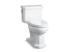 a white toilet sitting on top of a white floor