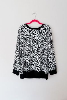 Stay cozy and wild in this Cheetah Print Jersey Knit Pullover Sweatshirt! The classic design - with a contrast neckline and cuffs - makes this a timeless addition to your wardrobe. Layer it with your favorite cold weather looks and express your wild side! Jersey Knit Crew Neckline Banded Cuff Side Slits Relaxed Fit 95% Polyester, 5% Elastane True to Size >> Approximate Measurements << S: Chest 40" Length 25"M: Chest 42" Length 26"L: Chest 44" Length 27"XL: Chest 46" Length 28"2XL: Chest 49" Length 29"3XL: Chest 52" Length 30" Model Sarah Measurements: 5’ 4”, Bust 34", Waist 24", Hips 34" Typically wears a size Small & 0. Wearing a size S here. Model Kylie Measurements: 5’ 5”, Bust 48", Waist 42", Hips 54" Typically wears a size 2XL & size 16W. Wearing a size 2XL here. Traci (that’s me with Leopard Print Crew Neck Top For Winter, Oversized Leopard Print Tops With Long Sleeves, Casual Leopard Print Long Sleeve Sweater, Casual Long Sleeve Leopard Print Sweater, Leopard Print Long Sleeve Sweater, Dress Layer, Swimwear Sets, Denim Leggings, Knit Pullover