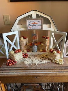 a table topped with lots of food on top of a wooden table next to a sign