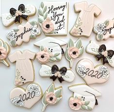 decorated cookies are arranged in the shape of baby's first birthdays and other items