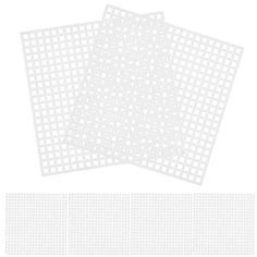 three pieces of white paper with squares on them