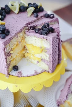 a cake with blueberries and lemons on it