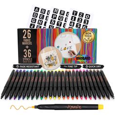 various markers and pencils are displayed in front of a box with stickers on it