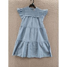 Sea Sevyn Pucker Smocked Dress Girls' 10y Blue Round Neck Cap Flutter Sleeves Sea Sevyn Pucker Smocked Dress Girls' 10y Blue Round Neck Cap Flutter Sleeves Retail $165.00 Elevate Your Little Girl's Summer And Spring Wardrobe With This Charming Sea Sevyn Pucker Smocked Dress. The Knee-Length A-Line Dress Features A Round Neckline And Short Cap Flutter Sleeves. It Comes With A Zipper Closure And Is Made Of A Blended Fabric Material That Is Machine Washable For Easy Care. The Dress Is In A Sol Casual Cotton Smocked Dress With Flutter Sleeves, Blue Summer Smocked Dress With Flutter Sleeves, Blue Smocked Dress With Flutter Sleeve For Summer, Blue Tiered Smocked Dress With Ruffle Hem, Casual Blue Smocked Dress With Flutter Sleeves, Blue Casual Cotton Smocked Dress, Casual Blue Smocked Dress With Ruffles, Casual Blue Cotton Smocked Dress, Blue Tiered Smocked Dress With Ruffles