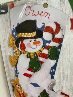 a christmas ornament with a snowman on it