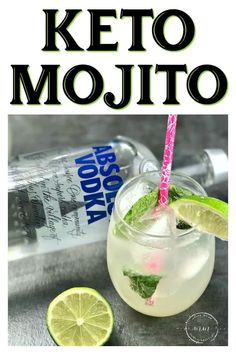 a bottle of mojito next to a glass filled with ice and lime