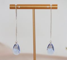 Elegant, light blue Swarovski Crystal threader earrings. Perfect for bridal showers or weddings. Entire earring length (from top of the earring wire to bottom of the pendant) is 65 mm. This listing is for the earrings in the first three photos only. Earrings in the last three photos can be found in the Swarovski Crystal Earrings Collection under shop sections. Each item is individually handmade and made to order. The colors of each piece may appear different on phones, tablets and computer scree Light Blue Sterling Silver Earrings For Wedding, Light Blue Sterling Silver Wedding Earrings, Light Blue Earrings, Earring Wire, Jewelry Care Instructions, Crystal Light, Earrings Elegant, Swarovski Crystal Earrings, Threader Earrings