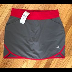 Nice Color Combo - Medium Gray And Dark Pink Waist & Trim (Pics Make It Look More Red Than Dark Pink) 2.5” Wide Waistband Front Slant Pockets Back Faux Pockets Built In Shorts Scalloped Side 14% Spandex Approx Measurements- Size S 15.5” Waist 4.75” Inseam On Innershorts 15.5” Length New W/ Tags Sporty Pink Tennis Skort, Pink Sporty Tennis Skort, Pink Sporty Skort For Sports, Sporty Pink Skort For Sports, Red Sporty Skort For Sports, Casual Red Sports Skort, Sporty Red Skort For Sports, Red Casual Sports Skort, Red Casual Skort For Sports