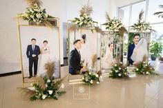 a couple posing for pictures in front of their wedding photos