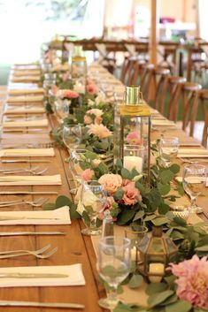 a long table is set with flowers and candles for an elegant dinner or reception party