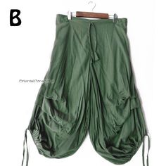 Deformed Aladdin pants with a unique irregular drape design sewn on the side of the knee. Highly breathable soft cotton (with lining), string and back rubber. The smooth and fluffy drape of the soft material is light. ＊2nd to 5th images are reference images with different colors. Material ： Cotton100% Color ： Green Measurements  Length :  ９０ｃｍ（３５．４'） Waist :   ６０ｃｍ～１１０ｃｍ（２３．６'～４３．３'） ＊Usual price ＄３９ 【 SHIPPING & DELIVERY 】 International Register  Air Mail to all over the world. The estimated de Bohemian Cotton Bottoms With Asymmetrical Hem, Bohemian Bottoms With Asymmetrical Hem For Spring, Bohemian Bottoms With Asymmetrical Hem For Summer, Bohemian Summer Bottoms With Asymmetrical Hem, Bohemian Harem Bottoms With Pockets, Bohemian Baggy Harem Pants With Pockets, Bohemian Festival Parachute Pants With Pockets, Bohemian Parachute Pants For Festivals, Bohemian Baggy Parachute Pants