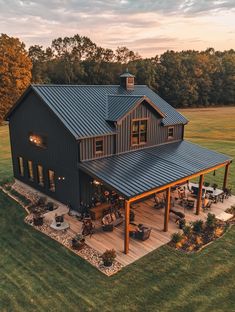 an aerial view of a large house in the middle of a field