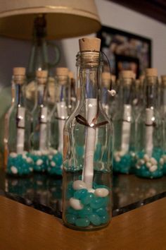 an empty bottle filled with blue and white candy