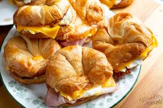 croissant sandwiches with ham and cheese on them