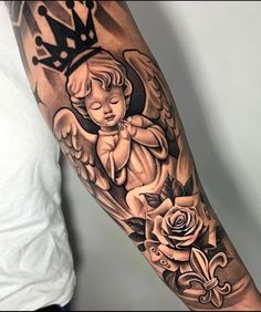 an angel tattoo on the arm with roses