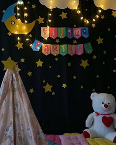 a child's bedroom decorated with stars and moon lights