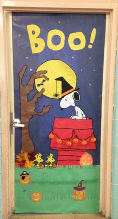 a door decorated to look like a halloween scene with snoop and pumpkins on it