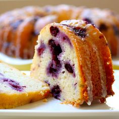 a blueberry bunt cake cut in half on a plate