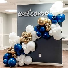 a welcome sign made out of balloons in an office