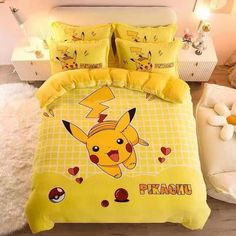 a pokemon bed set with pikachu and hearts on the comforter is shown