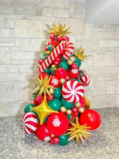 a christmas tree made out of balloons and candy canes