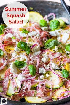 a salad with radishes, cucumbers and cheese in a skillet