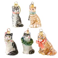 four glass ornaments with cats on them