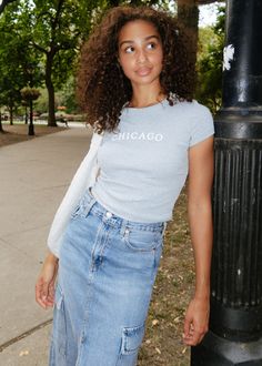 **Alice & Wonder original design** The perfect crop tee to throw on with jeans for a casual day in everyone's fav city .Micro blend rib baby tee with "Chicago" arch puff printed on front.Alice & Wonder logo printed small at back of neck. Model is wearing a size S. Fitted Casual Cropped T-shirt For Fall, Trendy Cotton Cropped T-shirt For Everyday, Spring Cotton Cropped T-shirt For Streetwear, Spring Streetwear Cropped Cotton T-shirt, Spring Streetwear Cotton Cropped T-shirt, Urban Cropped Tops For Spring, Spring Urban Cropped Tops, Fitted T-shirt For Day Out In Fall, Fitted T-shirt For Fall Day Out