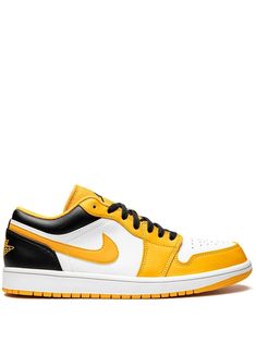 a pair of yellow and black sneakers on a white background with the word air jordan written in