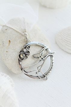 ITEM DESCRIPTION: The size of the pendant - H 4 х W 4 cm (1 1/2 x 1 1/2 inches), weight 7g. Jewelry will come to you in a gift box - ready for gifting. I made this motherhood jewelry of sterling silver, labradorite, and rainbow moonstone. This unique necklace looks so touching. This is a story of the relationship between parents and children. It is not easy. But this is important for each of us. I hope this wire wrapped necklace will be a wonderful gift for someone whole you love: for your mothe Gift Amulet Jewelry With Polished Finish, Amulet Style Jewelry With Polished Finish As Gift, Silver Medallion Jewelry Gift For Mom, Silver Medallion Jewelry As Gift For Mom, Wire Wrapped Pendant Jewelry Gift, Wire Wrapped Pendant Jewelry For Gifts, Wire Wrapped Round Pendant Jewelry As Gift, Spiritual Round Pendant Jewelry For Mother's Day, Unique Hand Forged Heart Pendant Jewelry