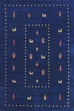 a blue rug with small animals and dots on the bottom, in different sizes and colors