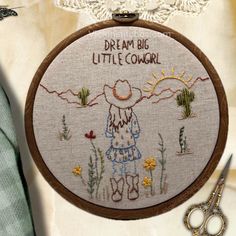 there is a cross stitch pattern on the hoop