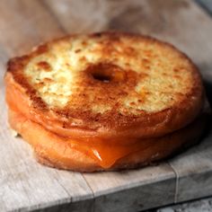 a grilled cheese sandwich sitting on top of a piece of wax paper