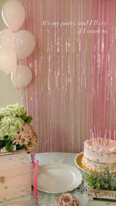 a table topped with lots of cake and balloons