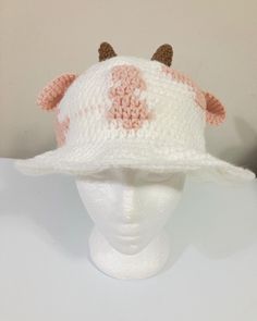 a crocheted hat with two horns on it