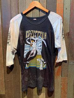 "The perfect Zeppelin ROCK T!  Vintage 1970s Led Zeppelin parking lot bootleg T shirt. Single stitch, sleeve print and paper thing/ almost see though. Its has some bleaching discolouration but gives this T so much style and character you'll never see another one like i.  Size S/M  Pit to pit - 20.5\"  Top to bottom - 26\"" Vintage Rock Tees 70s, 70s Led Zeppelin, 90s Culture, Vintage Rock T Shirts, Vintage Rock Tees, Oc Clothes, Heavy Metal Shirt, Led Zeppelin Shirt, Metal Shirts