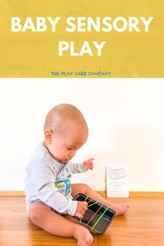 a baby sitting on the floor playing with a board game that says toddler game