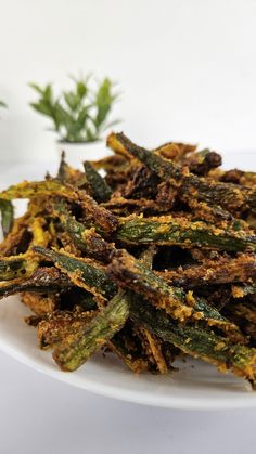 a white plate topped with fried green beans