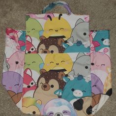 This Listing Is For A New Without Tags (Nwot) Squishmallows Comforter Bag. I Bought A New Squishmallows Comforter And This Is The Bag That It Came In. It Has A Velcro Closure And A Handle On The Top, Making It Easy To Carry. There Are No Flaws Whatsoever. This Comforter Bag Is Multicolored And Features Some Of The Most Popular Squishmallows Characters. The Measurements Of The Comforter Bag Are Shown In The Photos. Please Leave A Comment Below If You Have Any Questions. Offers Are Always Welcome! Cute Multicolor Cartoon Print Bags, Kawaii Multicolor Bags With Cute Design, Kawaii Multicolor Rectangular Bag, Cute Tote Diaper Bag, Kawaii Multicolor Bags For Everyday Use, Pink Cartoon Print Bag For Everyday Use, Playful Multicolor Cartoon Print Bag, Fun Pink Bags For Playtime, Cute Multicolor Tote Bags