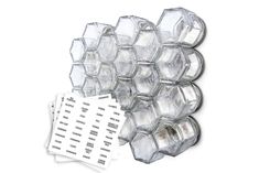 several clear hexagonal objects are stacked on top of each other with stickers