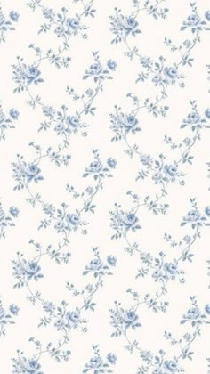 a blue and white wallpaper with flowers on it