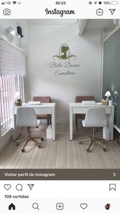 two white desks sitting next to each other in front of a wall with writing on it