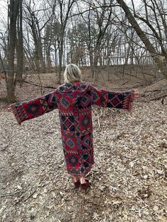 "Introducing my latest creation! Took two vintage tapestry blankets and fused them together to create this one of a kind, hooded dancing robe. Oversized hood, and front toggle closure for added functionality.  Sure to turn heads wherever you may wander! Measurements: Overall length: 53\" Sleeve length: 24\" Chest: 50\" This piece was made with all of my heart, for any human, anywhere, that may be attracted to its vibe! My intention is that the piece will amplify the divine nature of your inner b Bohemian Outerwear For Cold Weather, Cozy Oversized Outerwear For Festivals, Winter Bohemian Hooded Sweater Coat, Bohemian Hooded Sweater Coat For Winter, Oversized Bohemian Long Coat, Bohemian Hooded Sweater Coat For Fall, Western Blankets, Cabin Vibes, Tapestry Blanket