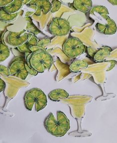 some cut up pieces of paper with lime slices on them