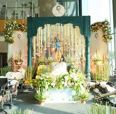 an outdoor shrine is decorated with flowers and greenery