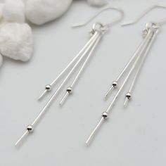 Make a statement in this long, silver dangle earrings. * Approximately 2.5" * Earrings are made from quality Sterling Silver wire and hold tiny sterling beads * Polished to a high shine * Choice of earring packaging with fun quotes! (Picture 3) These are thoughtfully handmade in my mountain studio at time of order, making each one unique. Nothing in my shop is mass produced. Every item is carefully created, packaged and shipped with tracking. Each order is boxed, gift-ready and includes a polish Minimalist Silver Linear Earrings, Silver Sterling Threader Earrings For Party, Silver Long Drop Threader Earrings For Party, Minimalist Silver Metal Threader Earrings, Silver Sterling Silver Threader Earrings For Party, Silver Adjustable Linear Earrings, Adjustable Long Drop Linear Earrings In Silver, Adjustable Long Drop Silver Linear Earrings, Everyday Silver Threader Earrings