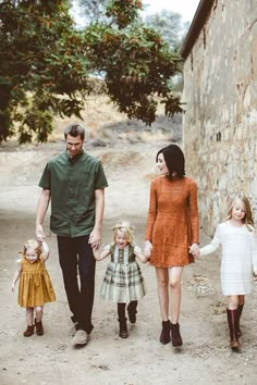 the family is walking down the street together