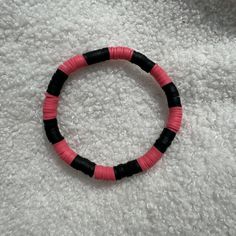 Artisan-crafted bracelet featuring pink and black Heishi clay beads, designed with a stretchy band for easy wear. Size of bracelet in photo: 7 1/2 inches Bracelets Clay, Perle Plate, Heishi Bead Bracelet, Clay Bead Bracelets, Clay Bracelets, Clay Bead Bracelet, Bracelets Ideas, Clay Bracelet, Clay Bead